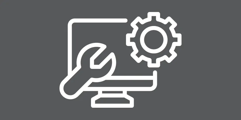 Computer monitor with a wrench and gear icon, representing scheduled system maintenance on a grey background.