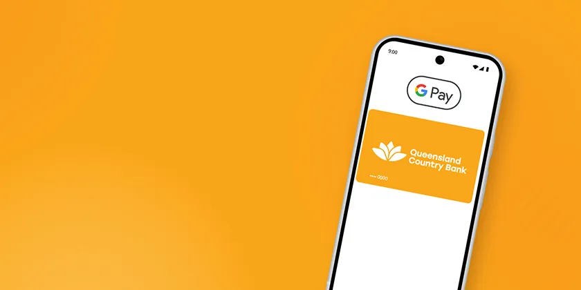 Smartphone displaying Google Pay with a Queensland Country Bank digital card on an orange background.