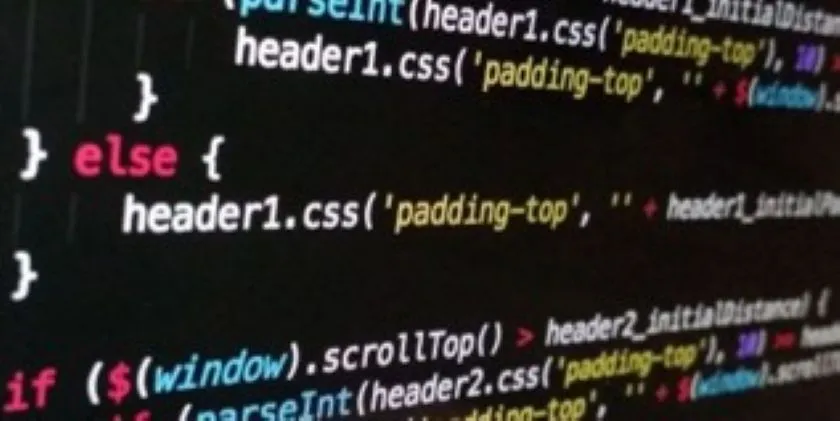Computer screen displaying source code with syntax highlighting and CSS and JavaScript components