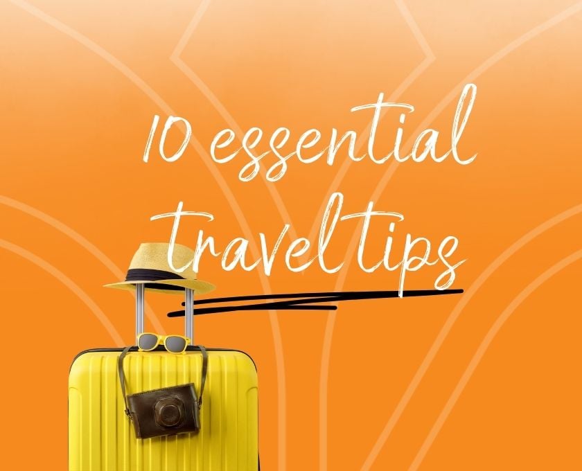 Yellow suitcase with hat, sunglasses, and camera on orange background featuring Queensland Country Bank logo and text ‘10 essential travel tips’.