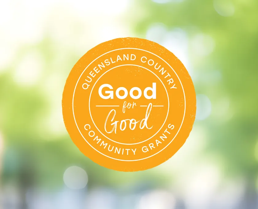 Queensland Country Good for Good Community Grants logo on a blurred green background